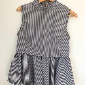 Never worn sleeveless blouse. Black and white